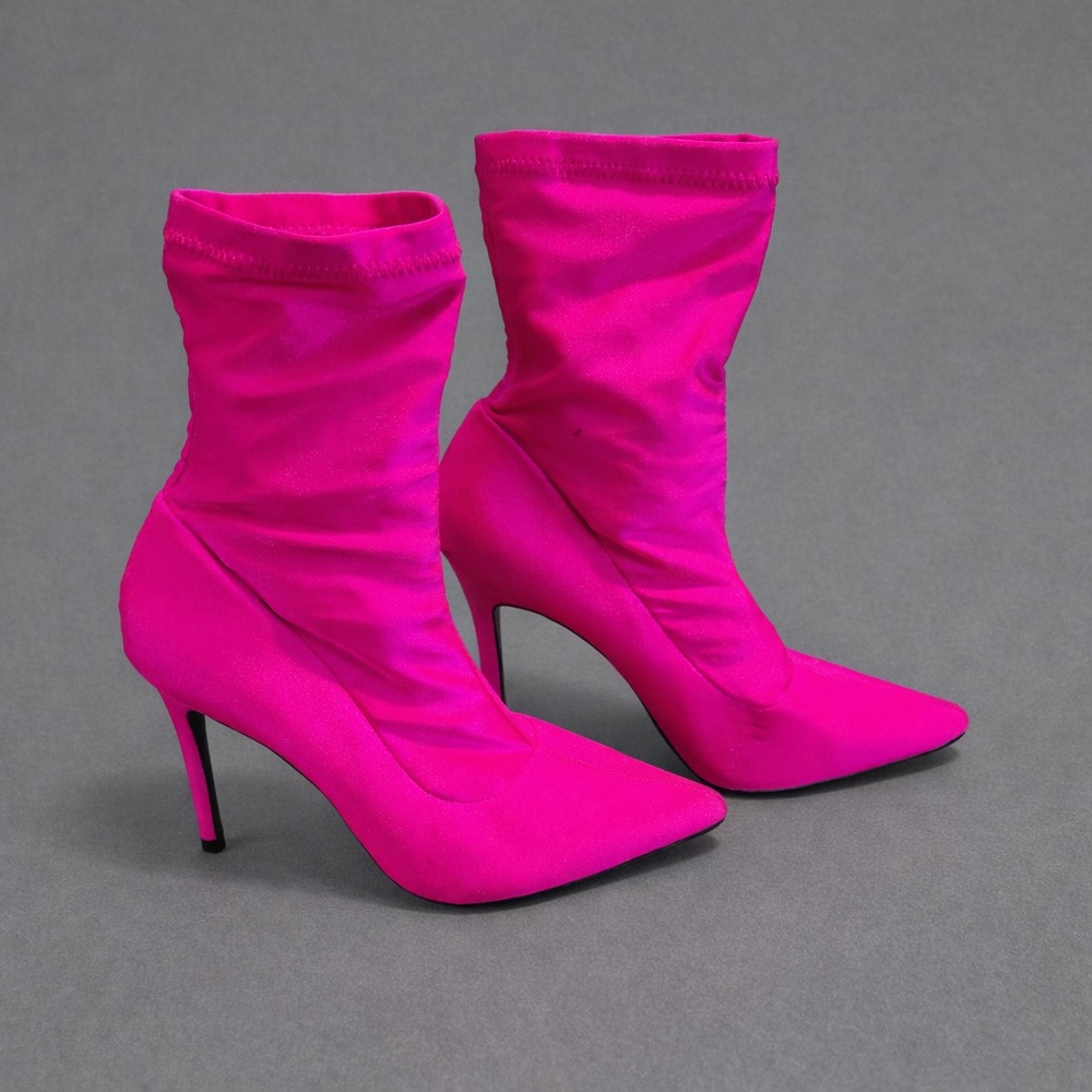 Light up the night in these bright hot pink heels. 4 & 1/4” heel